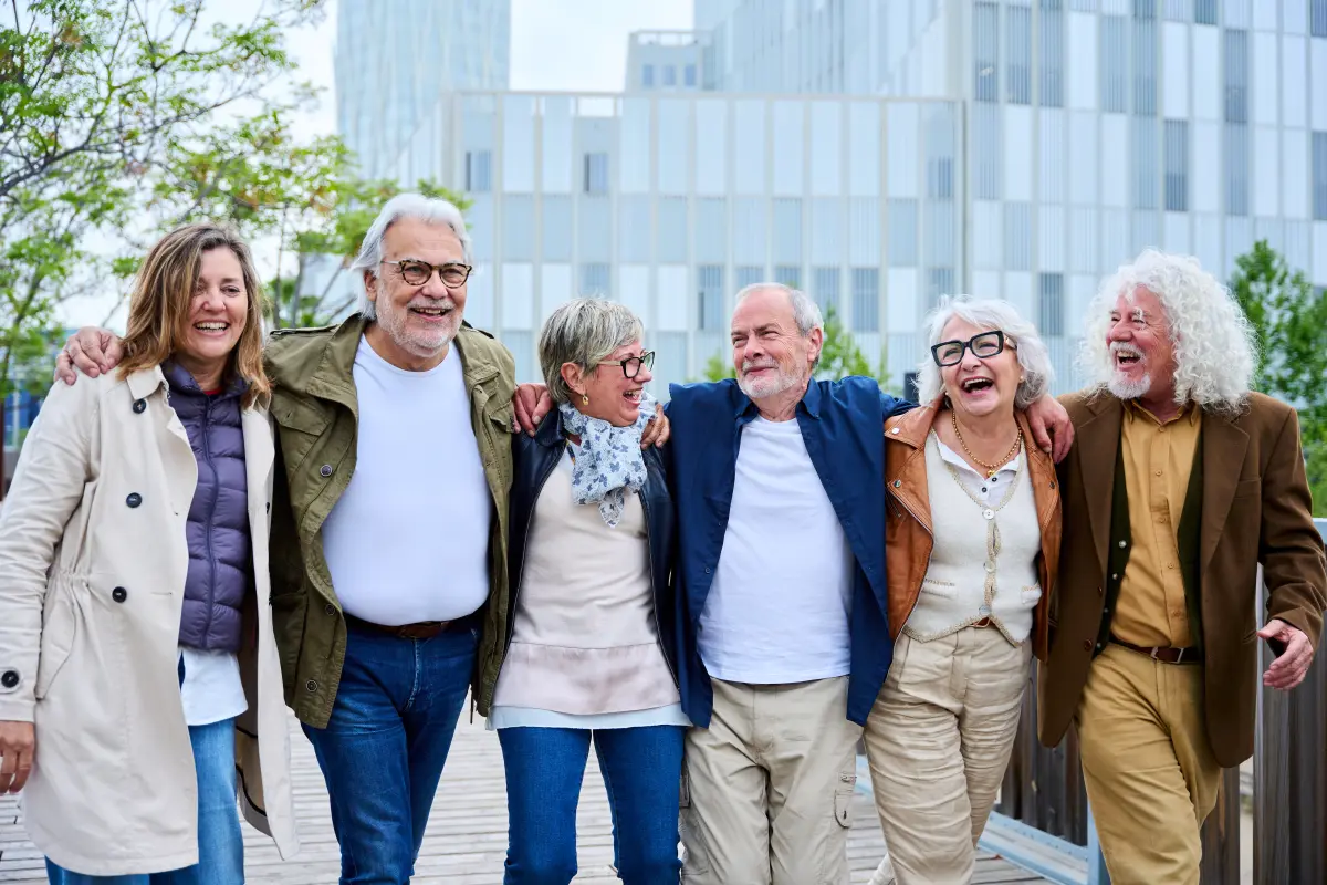 group-laughing-older-caucasian-people-enjoying-holidays-strolling-hugging-line-urban-park.webp